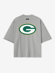 Back view of concrete heather Packers 90s 3/4 Sleeve Football Tee featuring large green and gold G logo centered