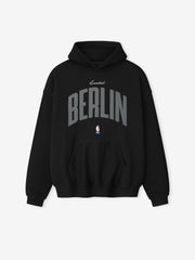 Front-facing black Berlin 90's Hoodie with large curved grey Berlin text and small NBA logo below pocket, gallery 0.