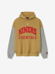 Front view of Forty Niners Sport Hoodie in prairie sand with gray sleeves and red Niners Essentials text on chest