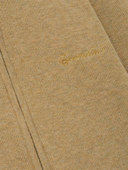 Beige fabric with gold embroidery on a matching beige background