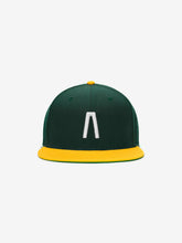 Fear of God Essentials 59FIFTY Athletics Cap in dark green with a bright yellow flat brim and button, featuring a raised white minimalist logo embroidered on the front panel.