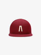 Fear of God Essentials 59FIFTY Athletics Cap in deep crimson featuring a minimalist cream emblem centered on the front panel with a structured flat brim design.