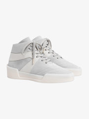 pair of off-white high-top basketball sneakers with smooth leather panels and thick rubber sole detail