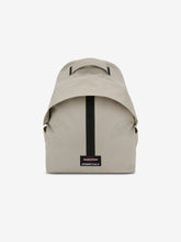 Essentials Backpack in beige shown from the front with a top carry handle central black zipper and rectangular logo patch on a clean white background