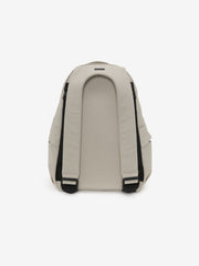 Essentials Backpack in beige shown from the back with padded shoulder straps black adjustment buckles and a curved rear panel against a clean white background