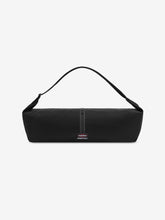 ESSENTIALS SHELL BAG LARGE in black with a curved top strap central zipper and small woven logo label displayed against a clean white background