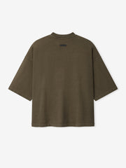 Back view of oversized short-sleeve tee in faded brown with small black rectangular label near neckline