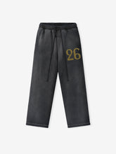 Off-black wide-leg sweatpants with elastic waistband and olive green printed number "26" on upper thigh area