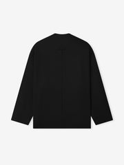 back view of black lightweight ripstop wool relaxed cropped jacket with clean hem and long sleeves