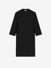 black double-breasted lapelless coat crafted from sculptural double weave virgin wool with clean minimalist design