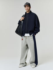 Bears Lounge Sweatpant in gray fleece with navy side panels and relaxed straight leg fit styled on a model as a Bottoms product view