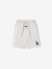 White pinstripe shorts with a blue logo on a white background