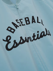 MLB Full Zip Bomber in muted blue featuring a centered black embroidered "Baseball Essentials" script across the chest, designed as a lightweight outerwear top.
