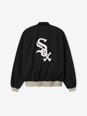 White Sox Half Zip Pullover in black featuring a large white team logo on the back, with beige ribbed cuffs and waistband for a relaxed fit outerwear top.