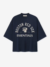 Red Sox AL Merch Tee in a dark sapphire hue featuring a relaxed fit with dropped shoulders and front graphic text "Boston Red Sox Essentials" with a vintage-style logo.
