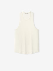 Ribbed Essential Tank in a soft ivory shade, crafted from smooth fabric with a relaxed fit and wide armholes for a clean, versatile layering top.