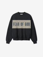 Cropped Relaxed Panelled Sweatshirt in dark iron grey with a contrasting muted taupe panel across the chest featuring bold Fear of God lettering, designed for casual streetwear layering.