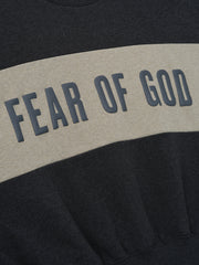 Cropped Relaxed Panelled Sweatshirt featuring a dark grey base with a wide contrasting muted beige horizontal panel across the chest displaying raised dark grey Fear of God lettering for a casual, contemporary look.