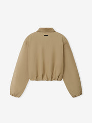 Womens Cotton Twill Work Jacket in soft beige shown from the back, featuring an elasticated hem and cuffs, a classic collar, and a clean, minimalist outerwear design.