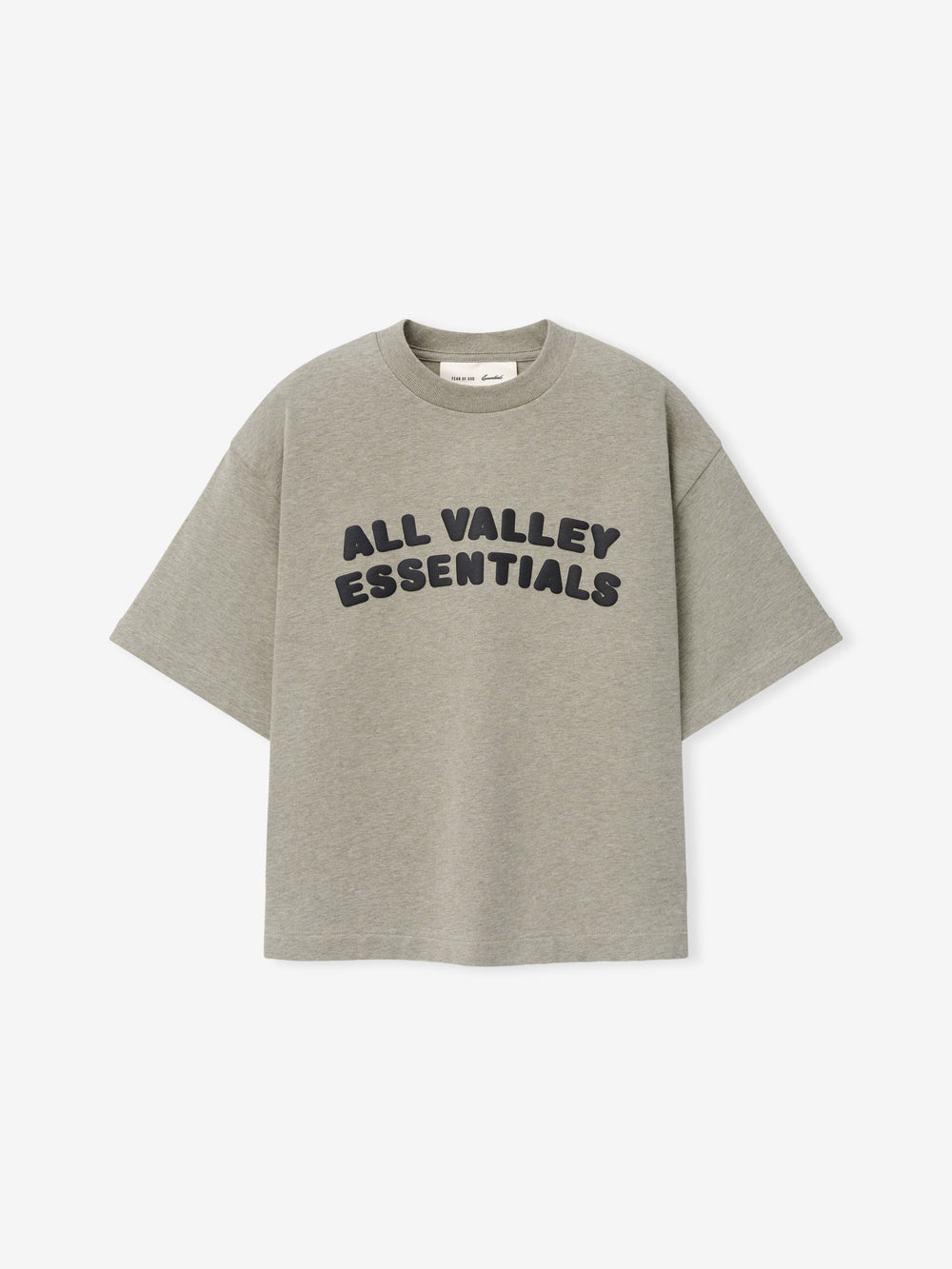 Kids Merch Tee in soft muted gray fabric featuring bold black rounded text "ALL VALLEY ESSENTIALS" in a curved layout for a casual, comfortable kids' top.
