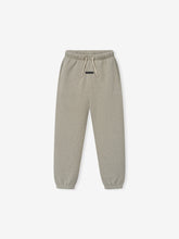 Kids Classic Fleece Sweatpant in a muted taupe heather color, featuring an elastic waistband with adjustable drawstrings, side pockets, and cuffed ankles for a cozy fit in kids' bottoms.