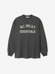 Merch Long Sleeve Tee in iron grey featuring soft cream "ALL VALLEY ESSENTIALS" lettering across the chest for a minimalist and casual top.