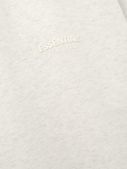 Essentials FW26 Classic Tee close up of soft off white cotton fabric with a raised tonal Essentials Fear of God chest logo Tops