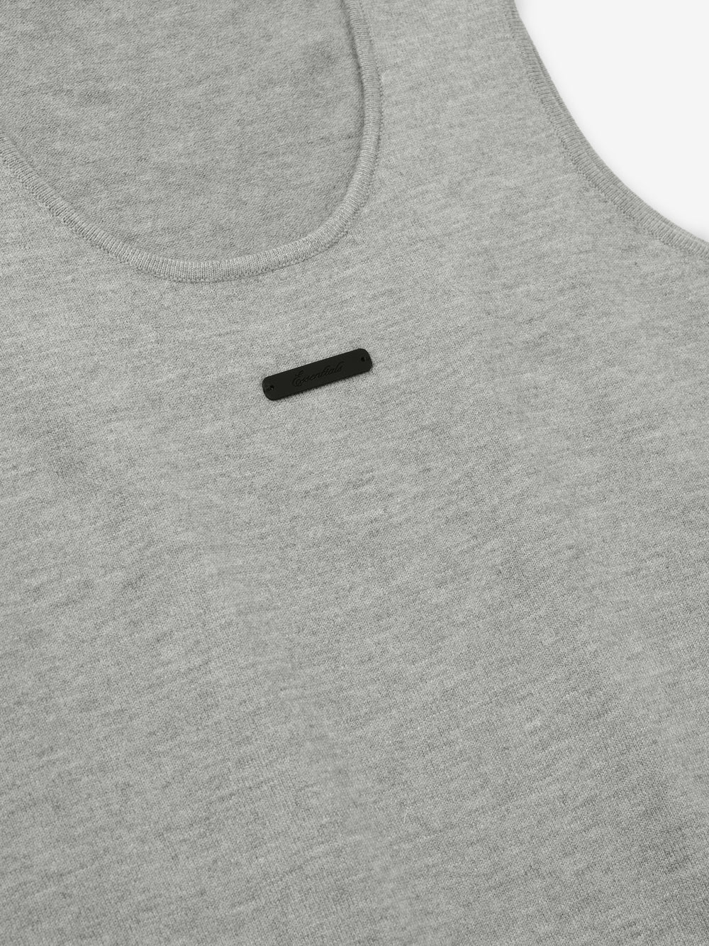 close-up of women's grey rib-knit tank top with scoop neckline and small black logo detail on chest