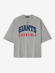 Front view of concrete heather Giants 90s 3/4 Sleeve Football Tee with navy Giants and red Essentials text centered
