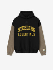 Black Steelers hoodie with contrasting brown sleeves and gold "STEELERS ESSENTIALS" text on front, patch on cuff.