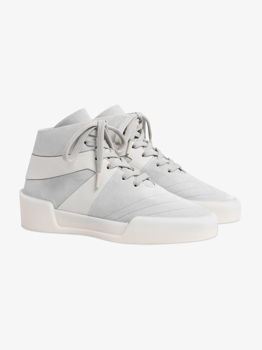 pair of off-white high-top basketball sneakers with smooth leather panels and thick rubber sole detail