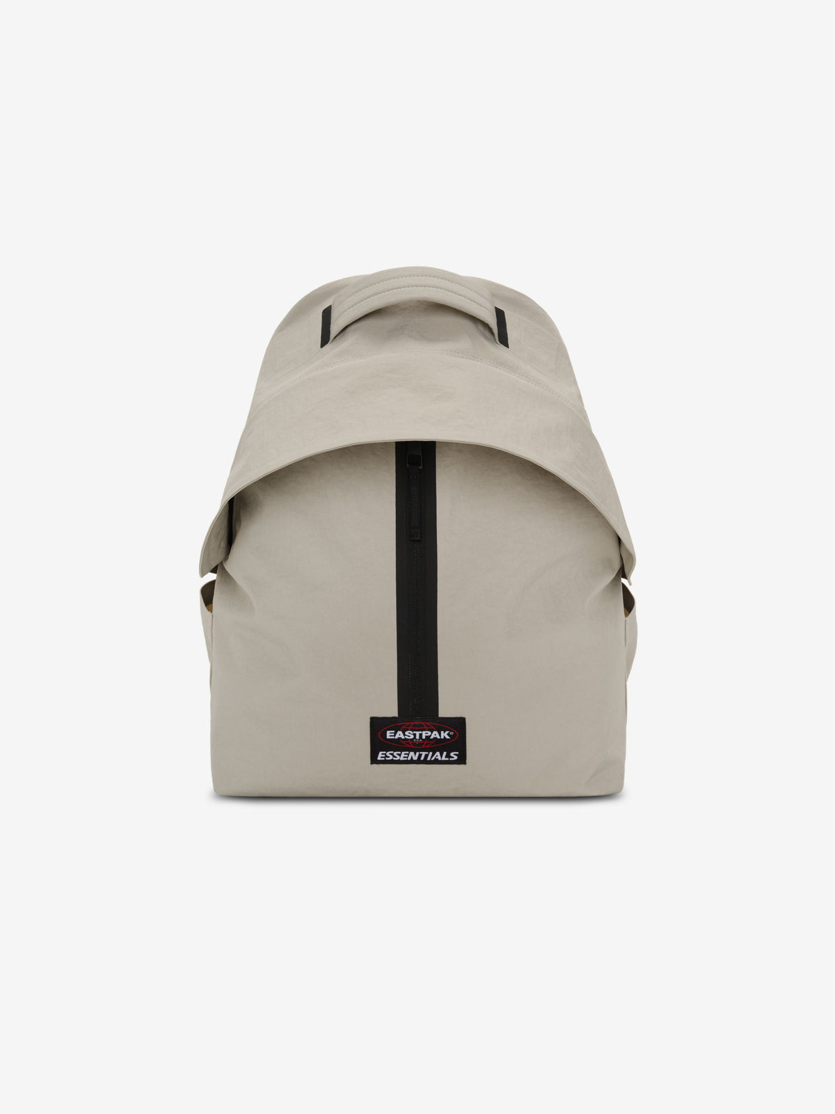 Essentials Backpack in beige shown from the front with a top carry handle central black zipper and rectangular logo patch on a clean white background
