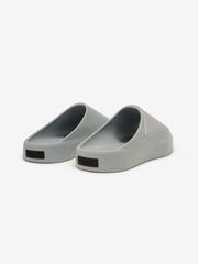 Essentials Los Feliz footwear in a smooth slate grey shade, featuring a streamlined slip-on style with a rounded toe and a thick, cushioned sole for everyday casual comfort.