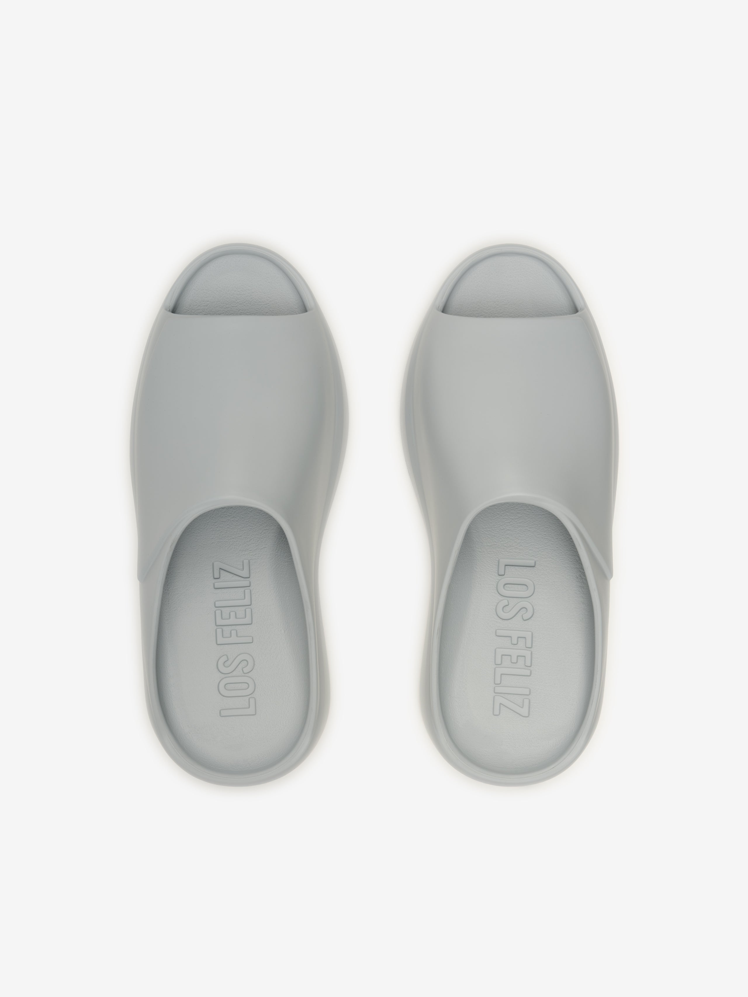 Essentials Los Feliz footwear in a smooth light grey shade featuring an open-toe slip-on design with a cushioned sole for comfortable, casual wear.