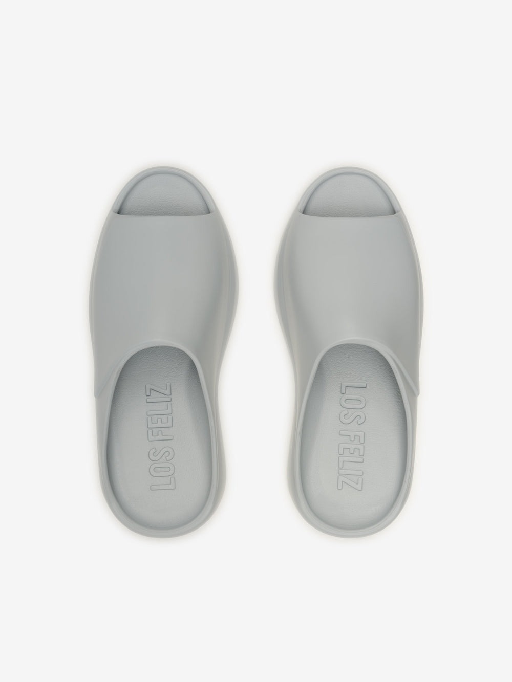 Essentials Los Feliz footwear in a smooth light grey shade featuring an open-toe slip-on design with a cushioned sole for comfortable, casual wear.