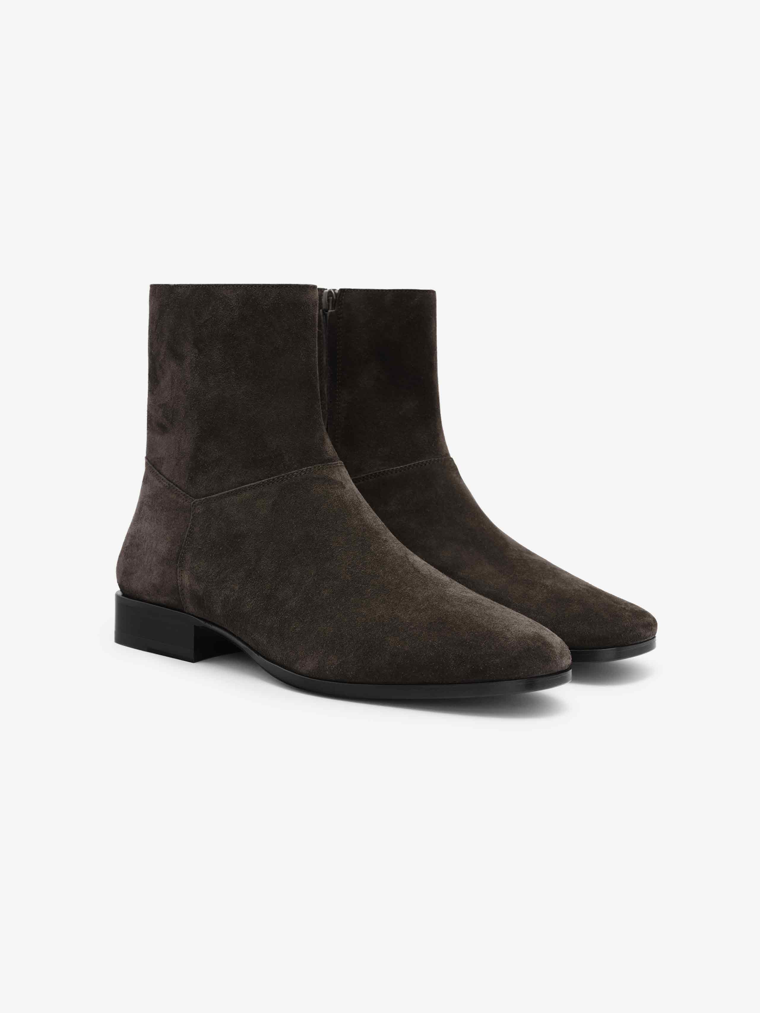 Suede Ankle Boot featuring a rich dark brown suede upper with a clean silhouette, pointed toe, side zipper closure, and low stacked heel for refined and versatile footwear style.
