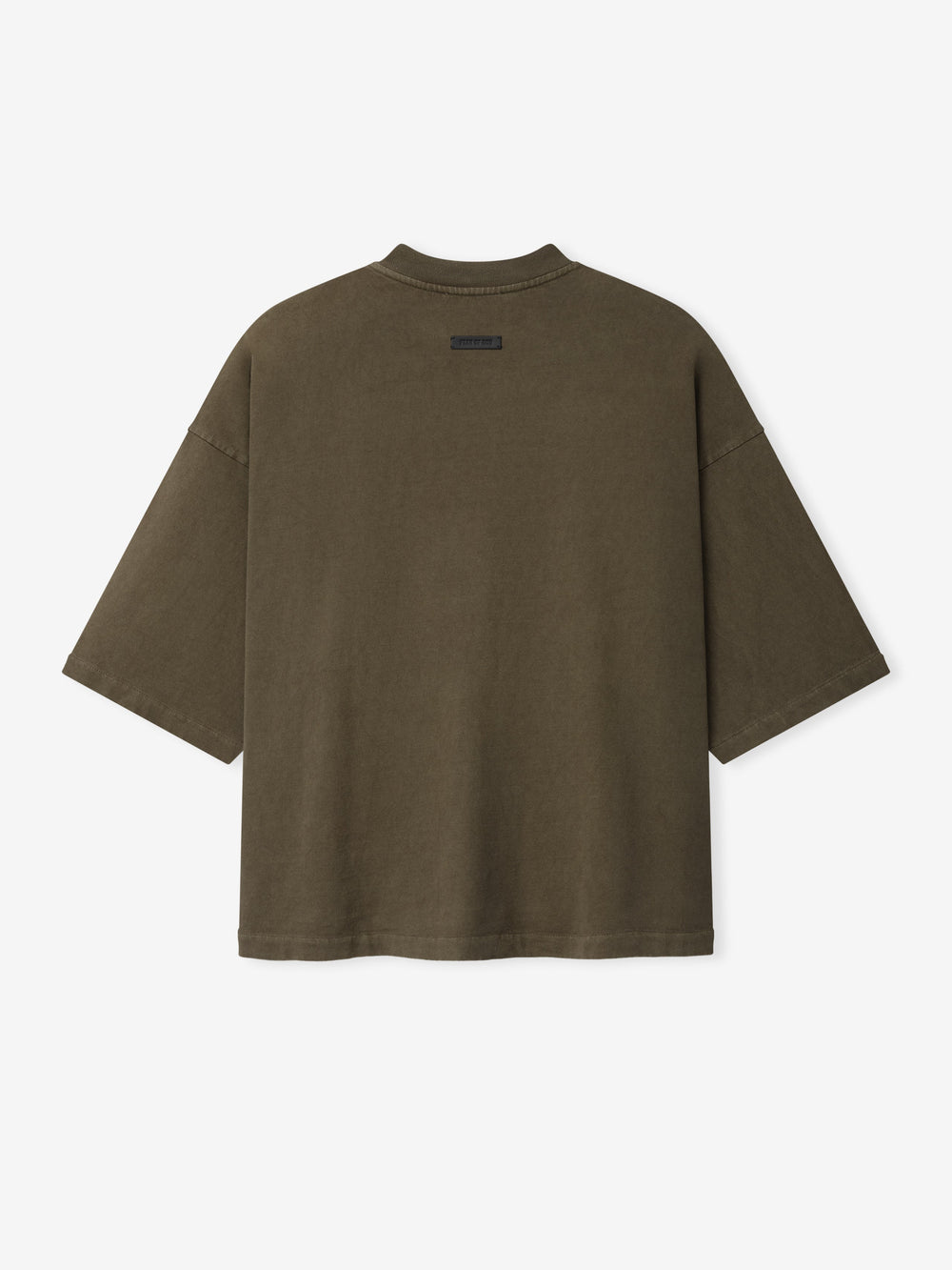 Back view of oversized short-sleeve tee in faded brown with small black rectangular label near neckline
