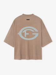 faded taupe heavyweight cotton tee with oversized light gray FG logo printed on back in vintage style