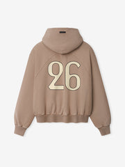 Back view of a dune-colored hoodie with a large cream-colored number 26 printed on the back