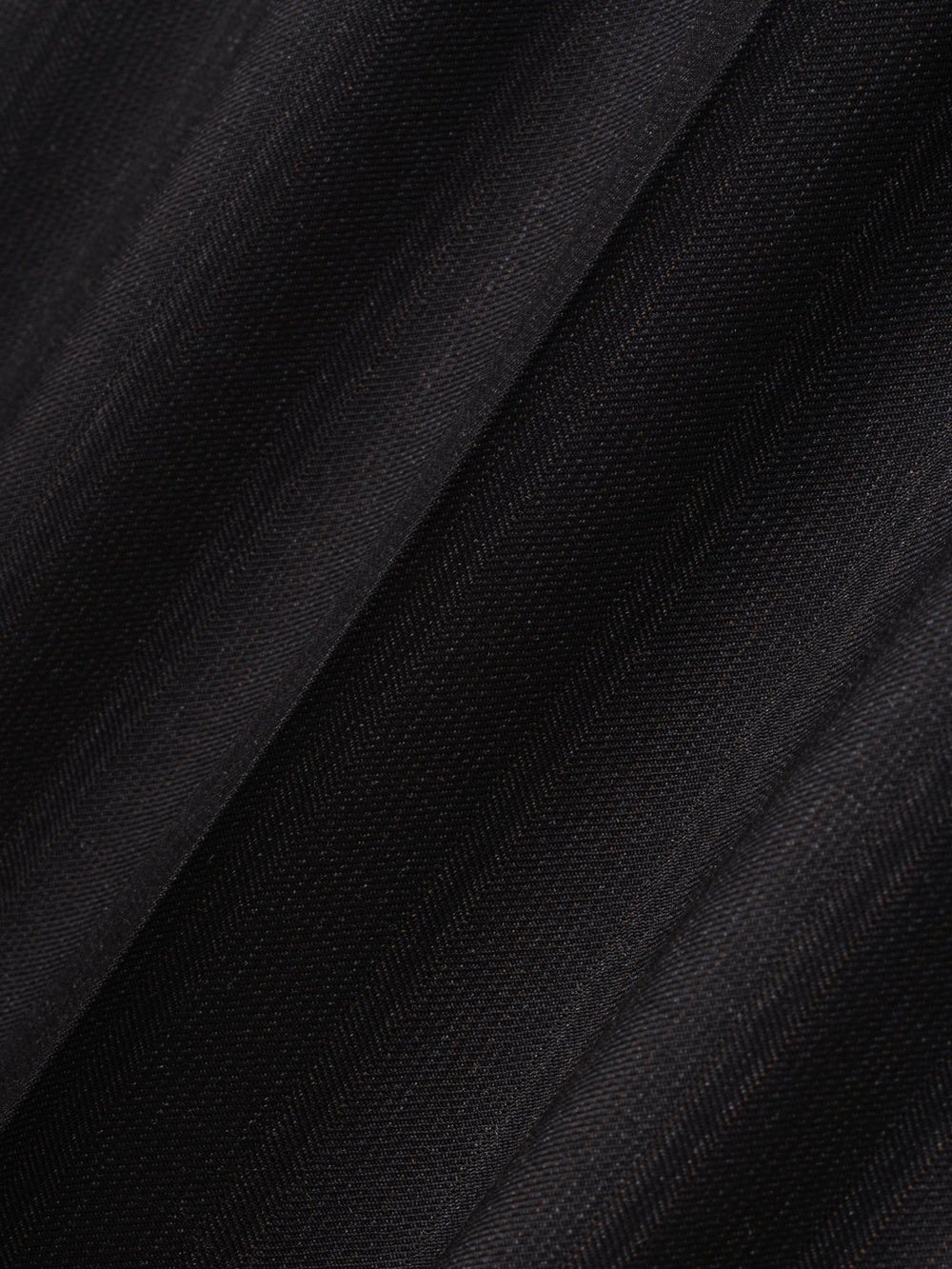 close-up of fine yarn-dyed wool fabric with subtle black stripes and soft matte finish for wide-leg pants
