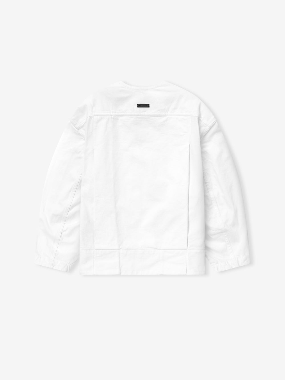 back view of optic white cotton broken twill relaxed lapelless denim jacket with deep pleats and snap buttons