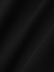 close-up of black compact rip-stop virgin wool fabric with subtle grid texture and smooth matte finish