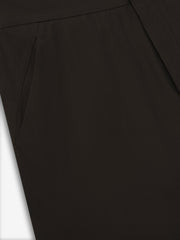 close-up of dark brown womens worker pants showcasing smooth fabric and side slit pocket detail on neutral background