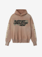 Front view of dune pearl Liberation Now Hoodie with bold black "Support Liberation Now" text over muted green brushstroke FGDSYF-FLC004U