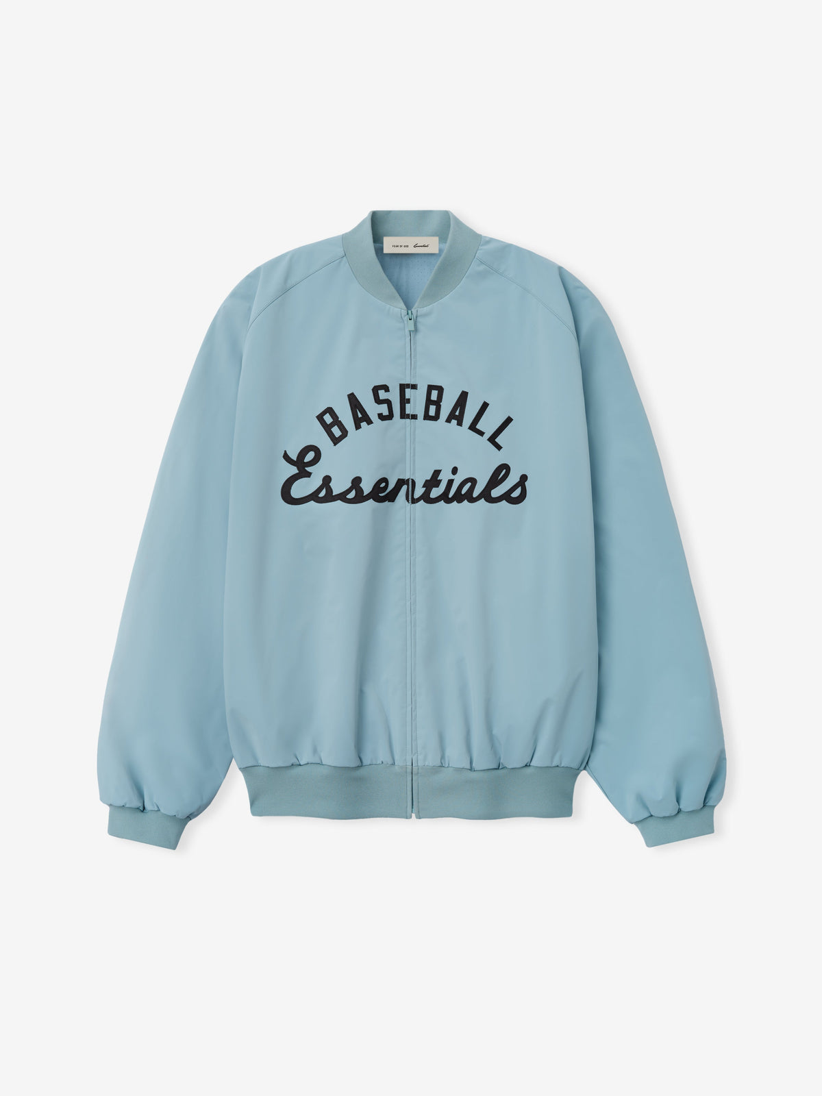MLB Full Zip Bomber in soft stone blue featuring a full front zipper, ribbed collar, cuffs, and hem, with bold black embroidered "Baseball Essentials" text across the chest, designed as lightweight outerwear.
