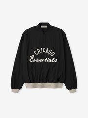 White Sox Half Zip Pullover in black with white "Chicago Essentials" script on the front, featuring beige ribbed cuffs and waistband for a relaxed fit outerwear top.