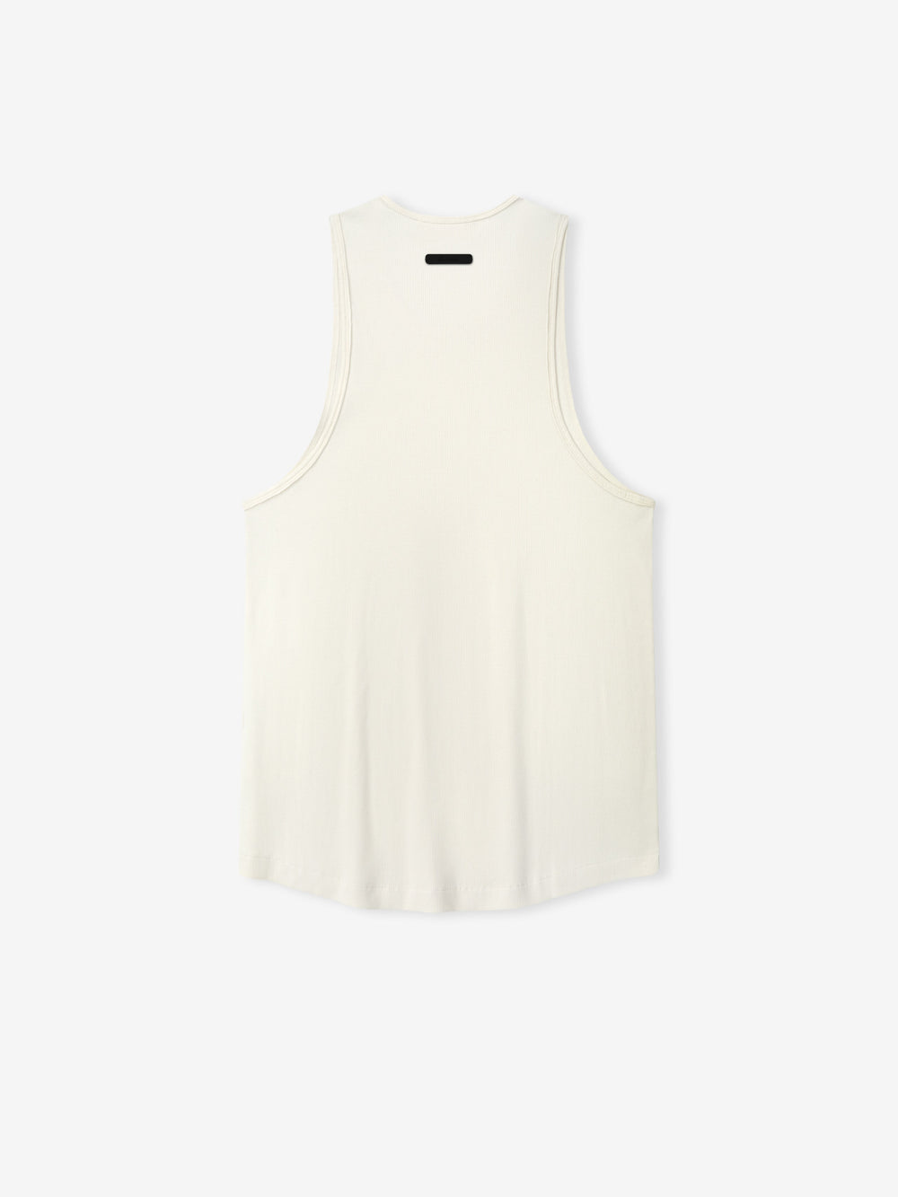 Ribbed Essential Tank in a soft ivory shade, featuring a smooth ribbed fabric with a relaxed cut and wide armholes for comfortable casual layering tops.