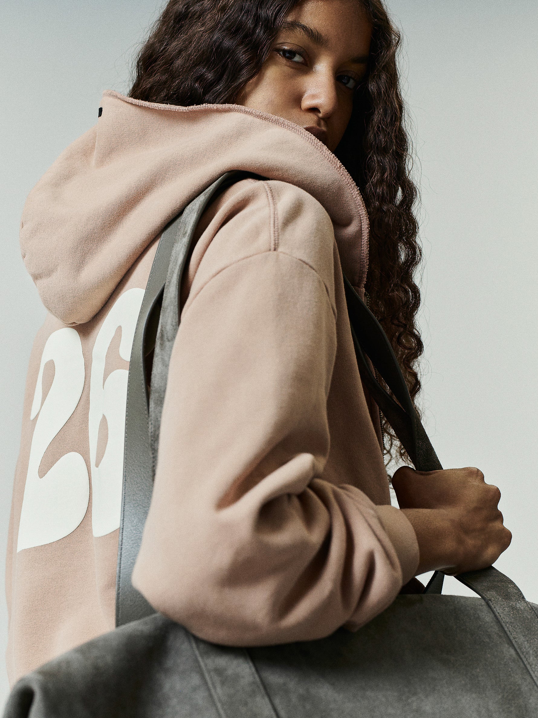 Womens 90s Full Zip Hoodie in soft washed ginger featuring a relaxed fit, oversized hood, and bold white graphic detailing on the back for a vintage-inspired outerwear look.