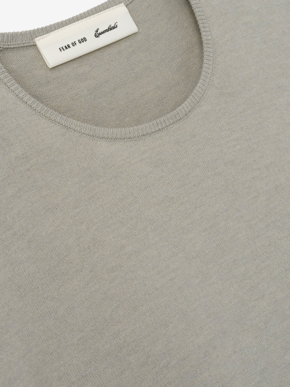 Womens Soft Knit Slim Longsleeve in a muted beige tone, crafted from fine knit fabric with a smooth round neckline and tailored slim fit for a versatile, sleek casual top.