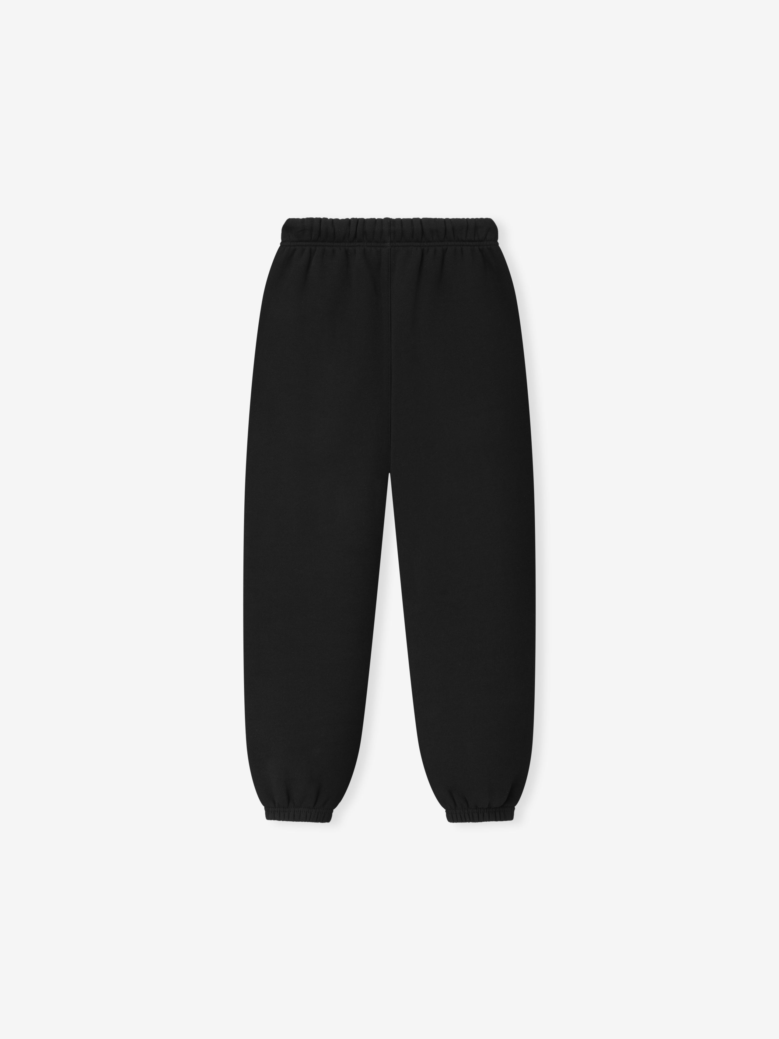 Kids Essentials FW26 Classic Sweatpant in black displayed flat with elastic waistband tapered legs and gathered cuffs Bottoms